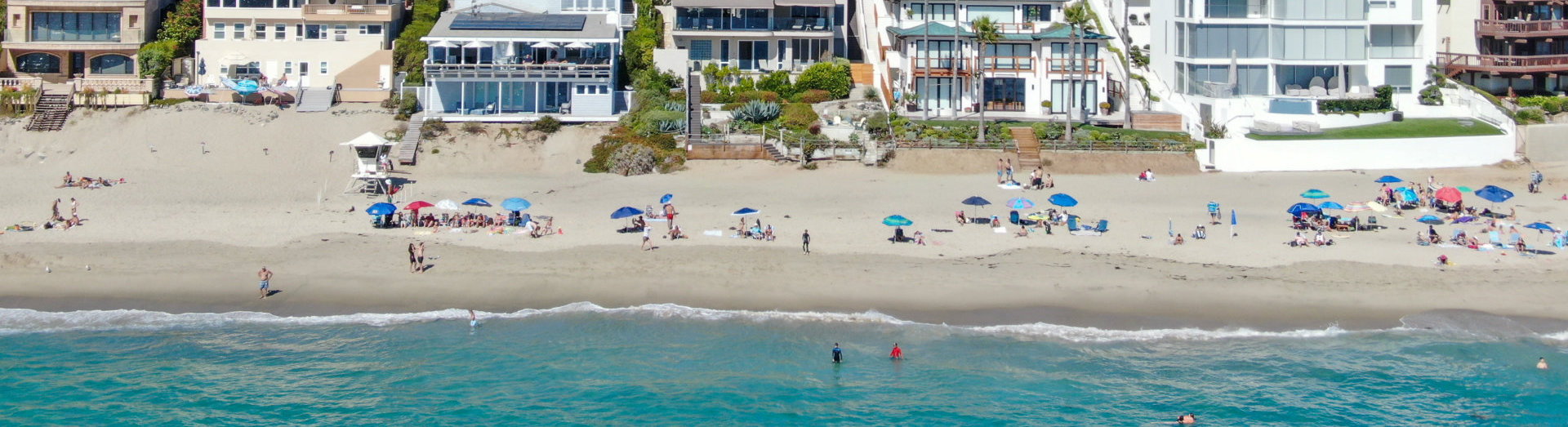 Beach coastline with tourist enjoying the summer day